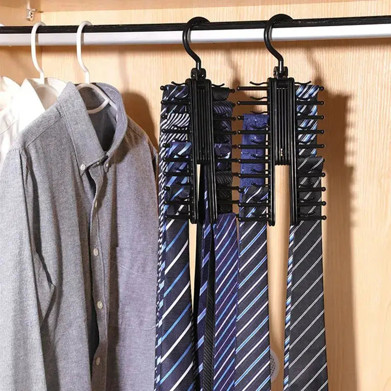 Adjustable tie storage rack with two black 360-degree rotating organizers holding ties and belts in a closet.