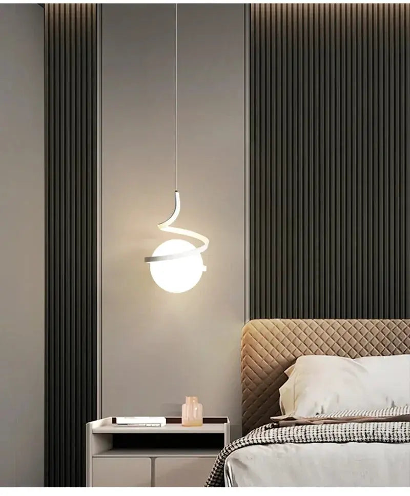 Simples Market Nordic LED pendant light with white globe and curved spiral arm over bedside in modern bedroom
