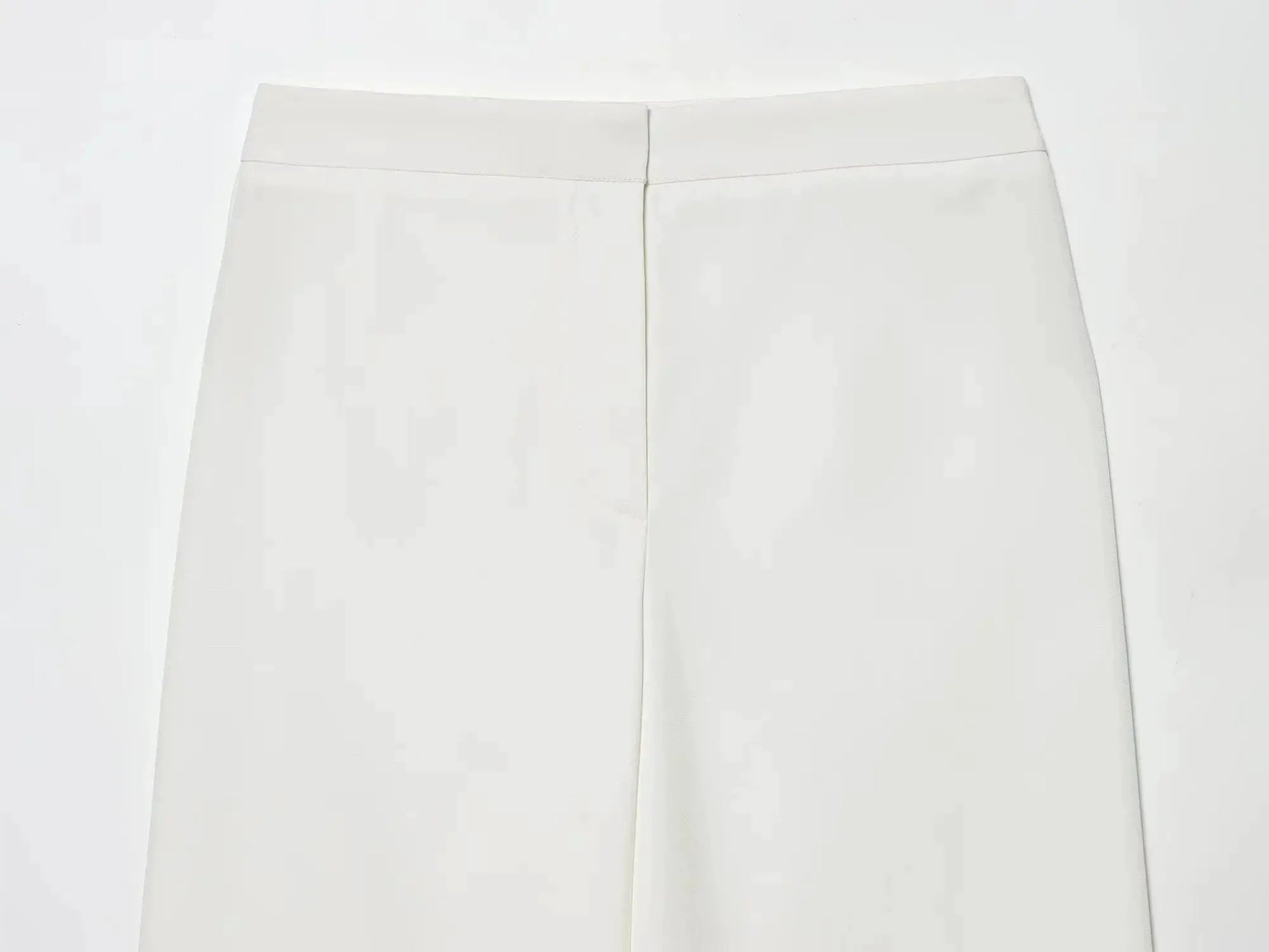 White women's dress pants with front center seam and tailored fit