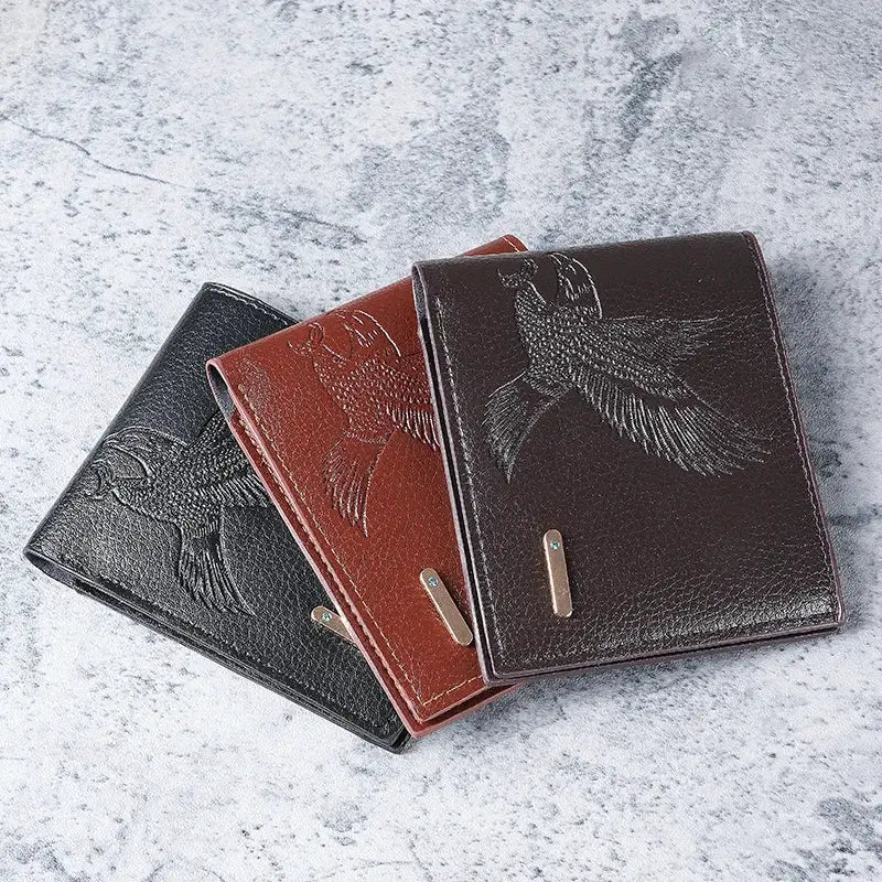 Three men's slim leather wallets with eagle embossing and a metal accent plate in black, brown, and dark brown