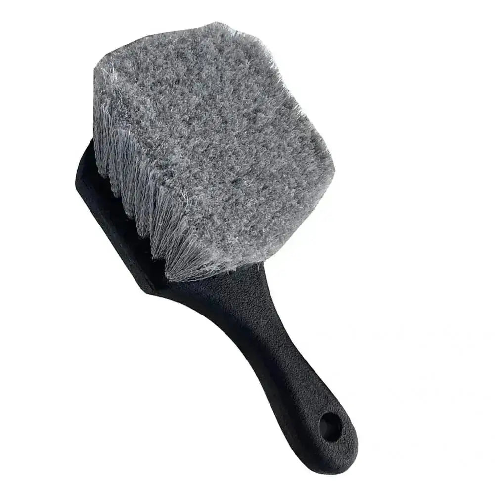 Car wheel cleaning brush with short black handle and gray bristle head