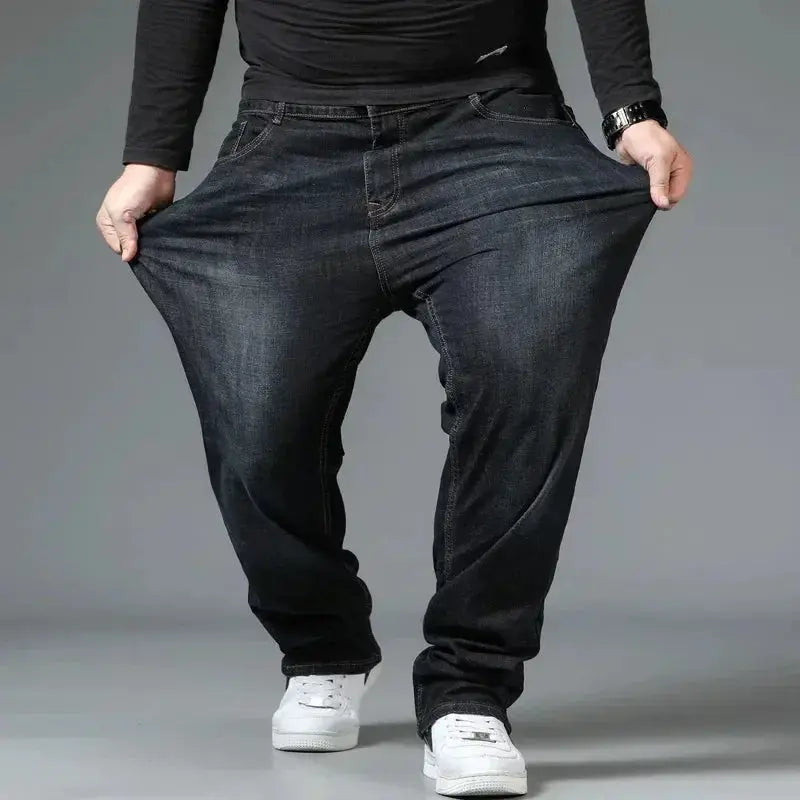 Mens black oversized denim jeans by Simples Market; high-waist, loose-fit plus-size trousers