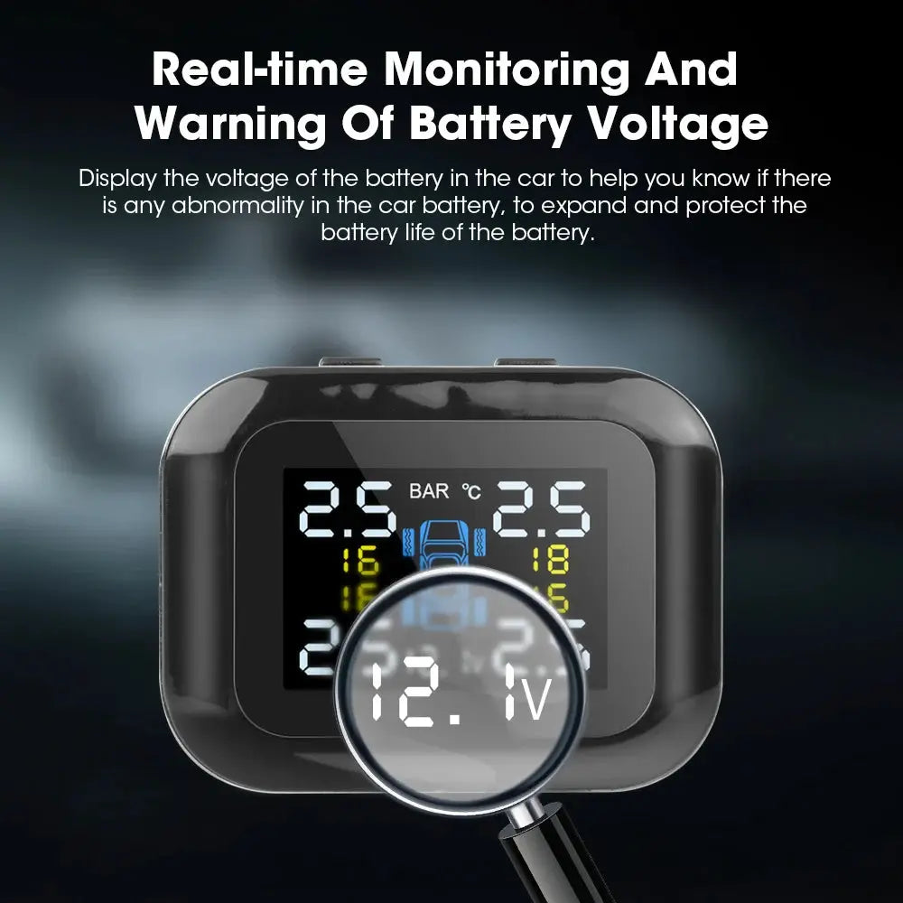 Car TPMS monitor in black with a digital display and magnified 12.7V reading.