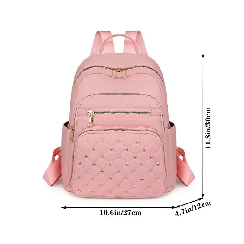 Travel backpack, pink quilted front pocket with gold zippers; double-shoulder, roomy multi-purpose bag.