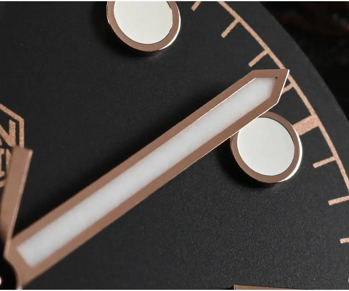 San Martin BB 40mm diver watch components in rose-gold tone, bracelet link pieces with white padding on dark background