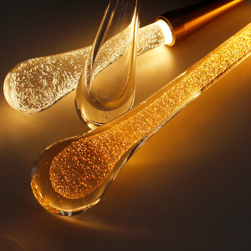 Crystal LED pendant lights by Simples Market with gold glass droplets for dining and living rooms