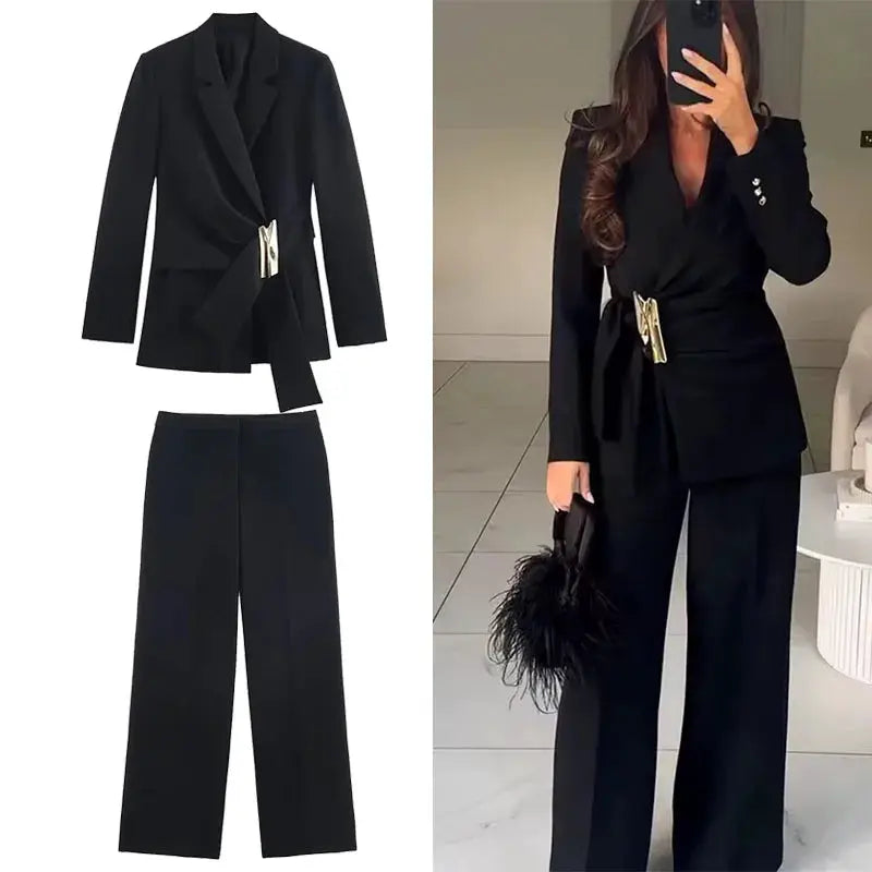Two-piece black women's suit set with belted blazer featuring a buckle and straight-leg pants