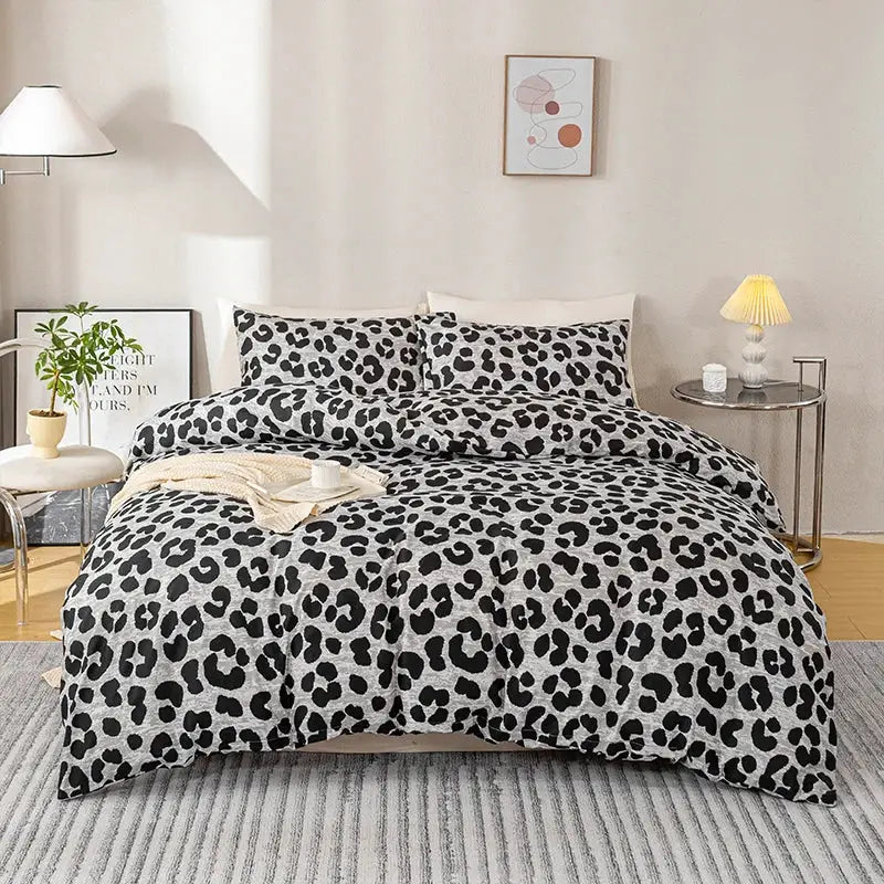 3-piece leopard print duvet cover set on bed with 2 pillowcases; gray/black pattern, soft skin-friendly bedding
