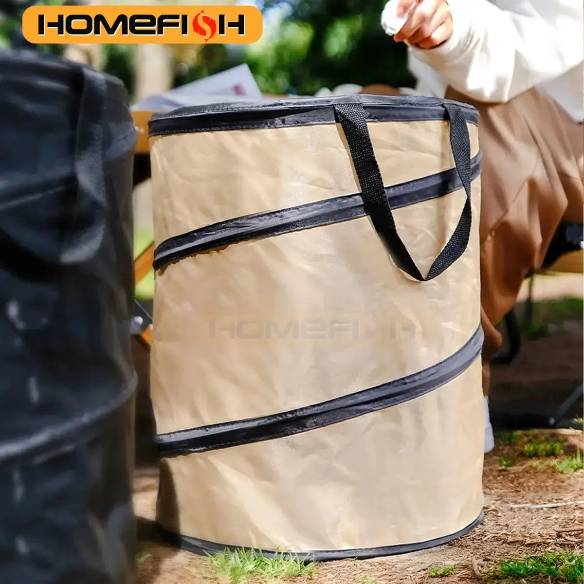 Pop-up camping trash can, beige with black straps; Homefish logo visible