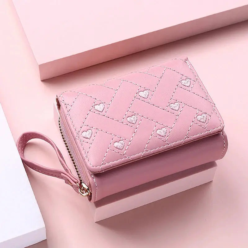 Women's pink PU tri-fold wallet with heart embroidery and wrist strap