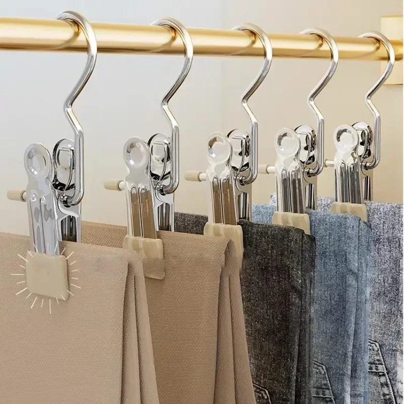 Stainless steel clothespin room organizer by Simples Market, 6 extendable clothes rack clips on a gold rod