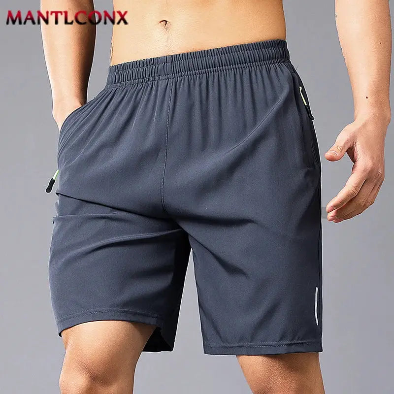 Men's quick-dry jogging shorts in dark gray with elastic waistband and zip pockets MANTLCONX