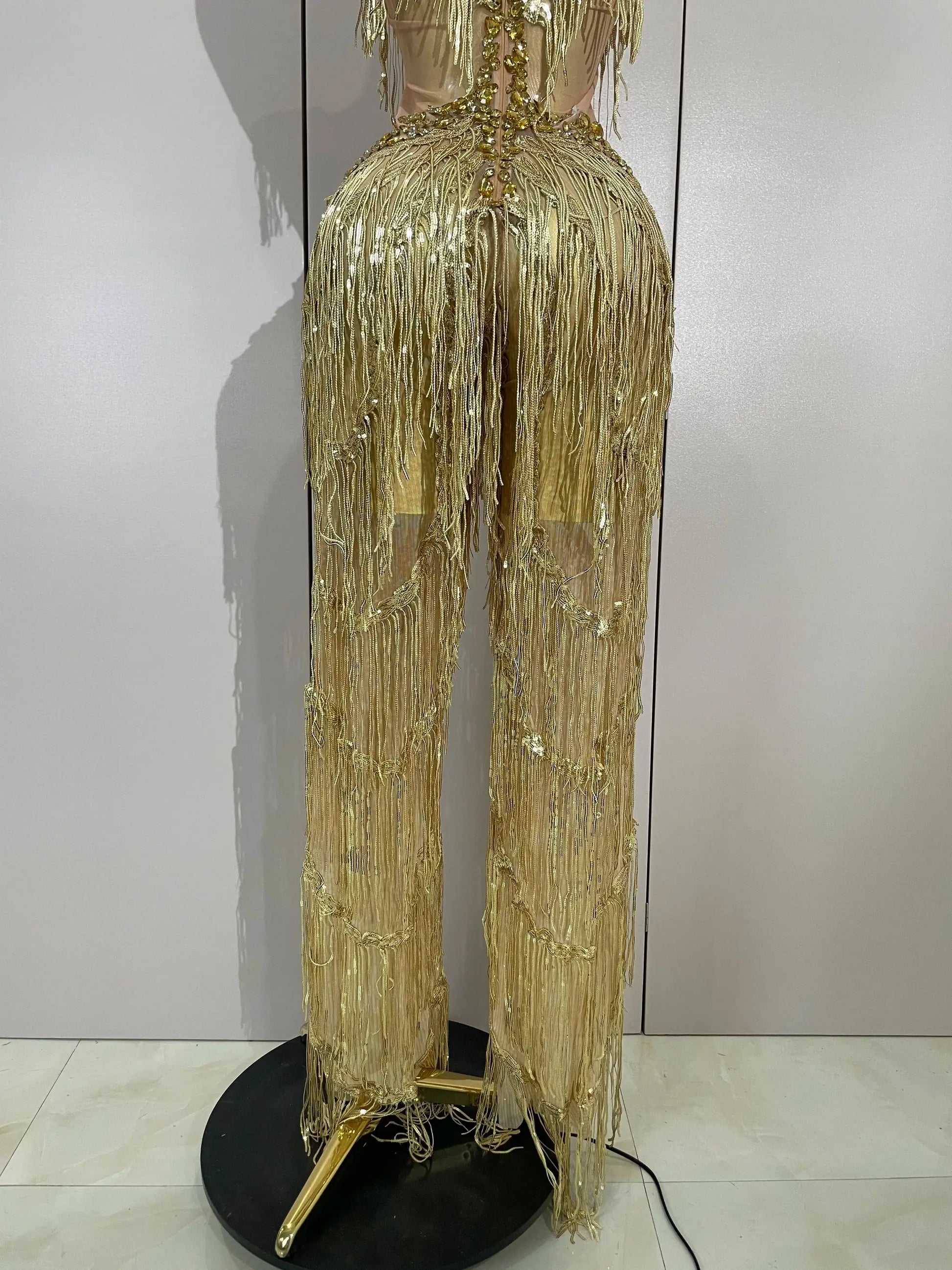 Sequined fringe jumpsuit in gold with rhinestone accents for stage performances