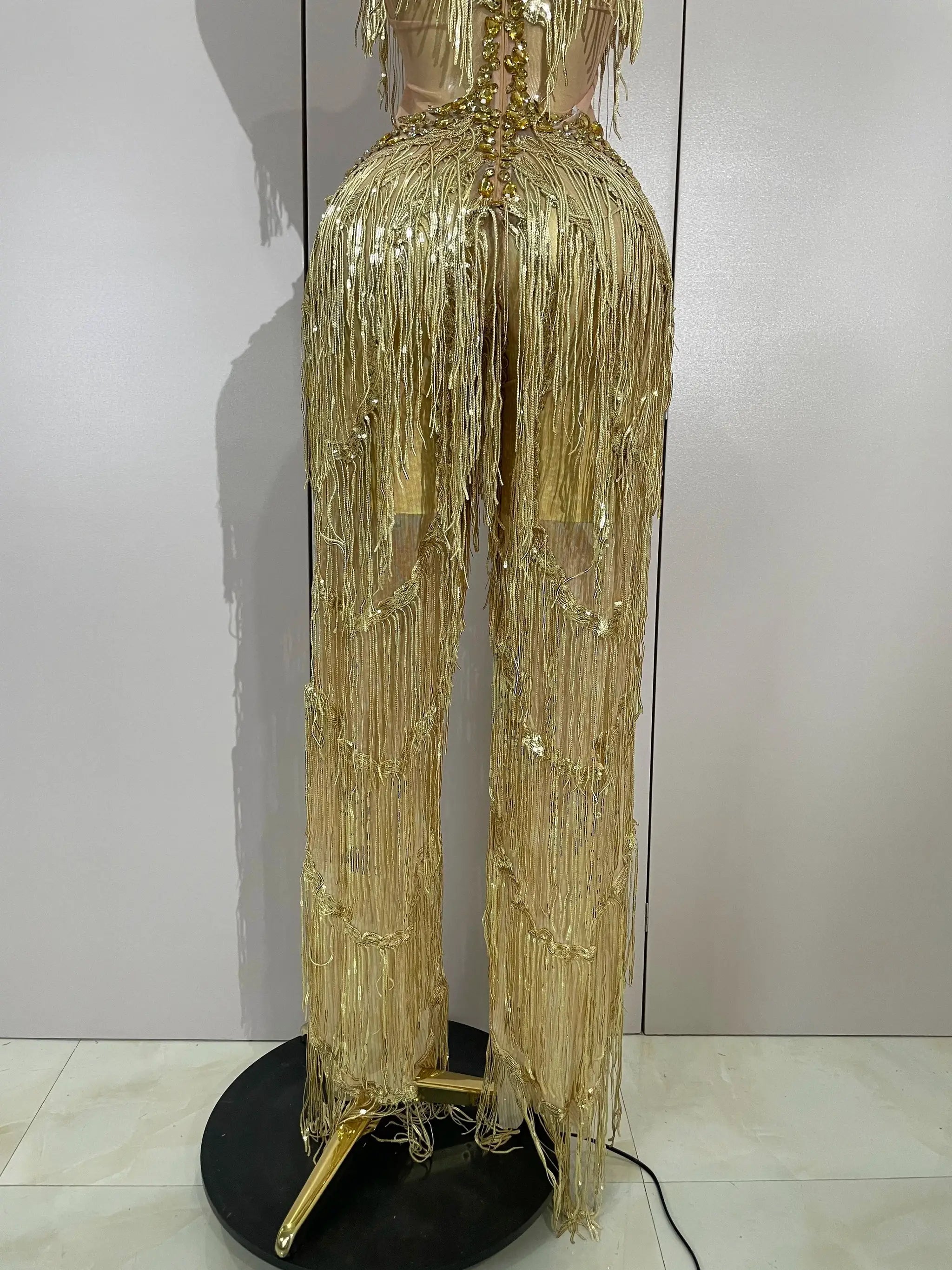 Sequined fringe jumpsuit in gold with rhinestone accents for stage performances