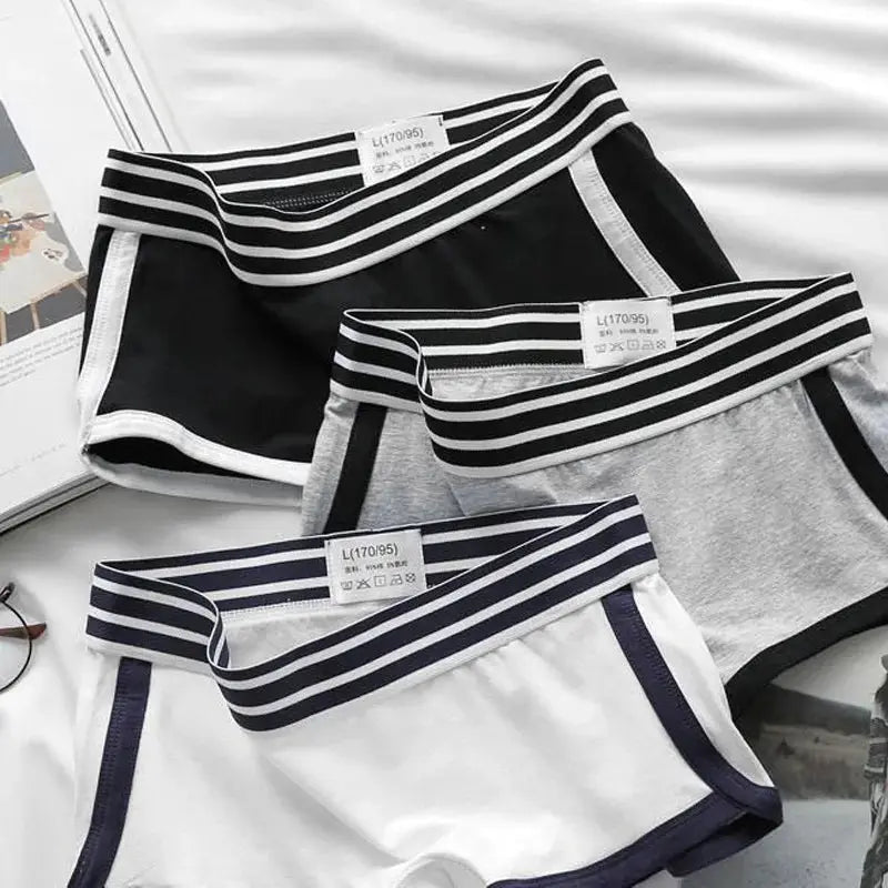 Women's low-waist boxer briefs set in black, gray, and white with striped waistbands; breathable 3-pack