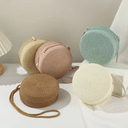 Minimalist round straw crossbody bags set of five in beige, blush pink, tan, cream, and mint by Simples Market