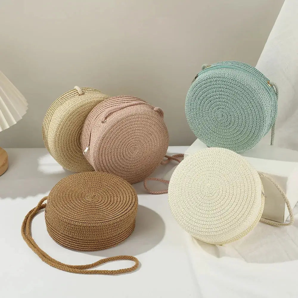 Minimalist round straw crossbody bags set of five in beige, blush pink, tan, cream, and mint by Simples Market