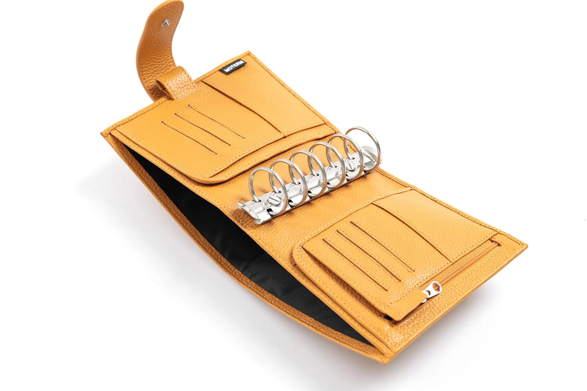 Moterm Luxe 2.0 pocket planner in tan pebbled leather with 30mm rings and card slots, an A7 mini organizer.