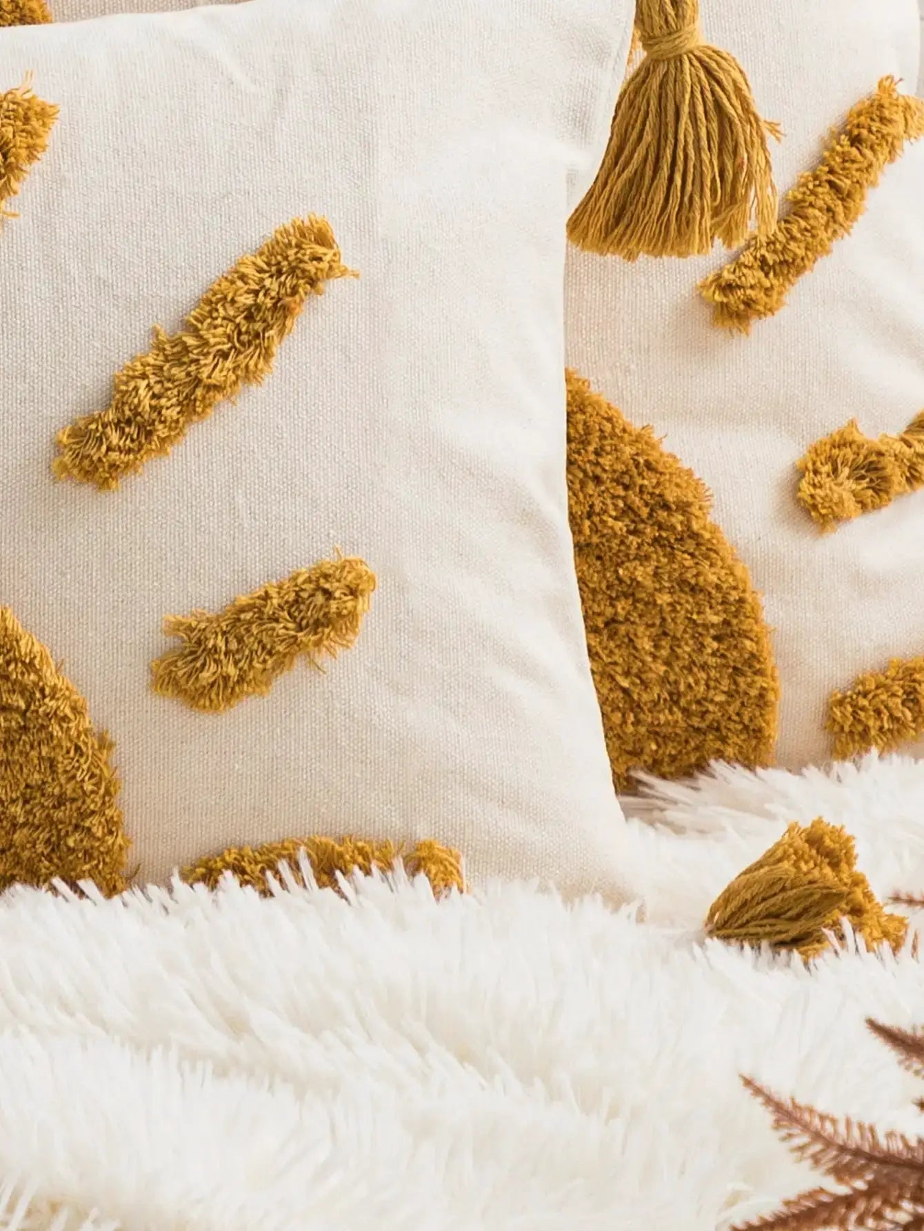 Yellow sun-pattern pillowcase cover on cream bohemian cotton sail fabric with tufted motifs