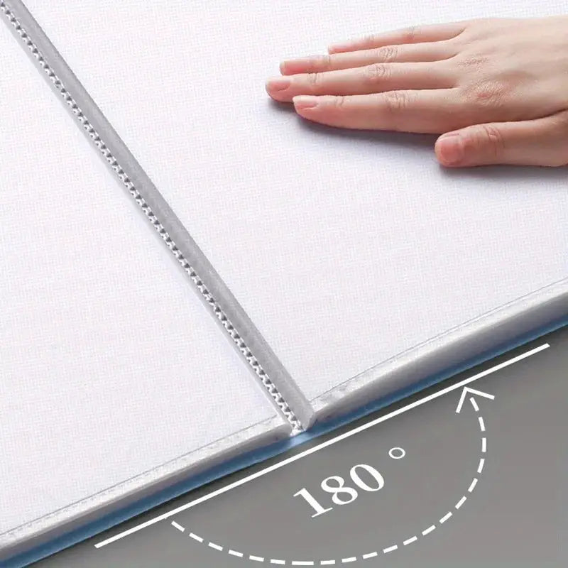 Portfolio binder by Simples Market with 180-degree lay-flat hinge for white design documents.