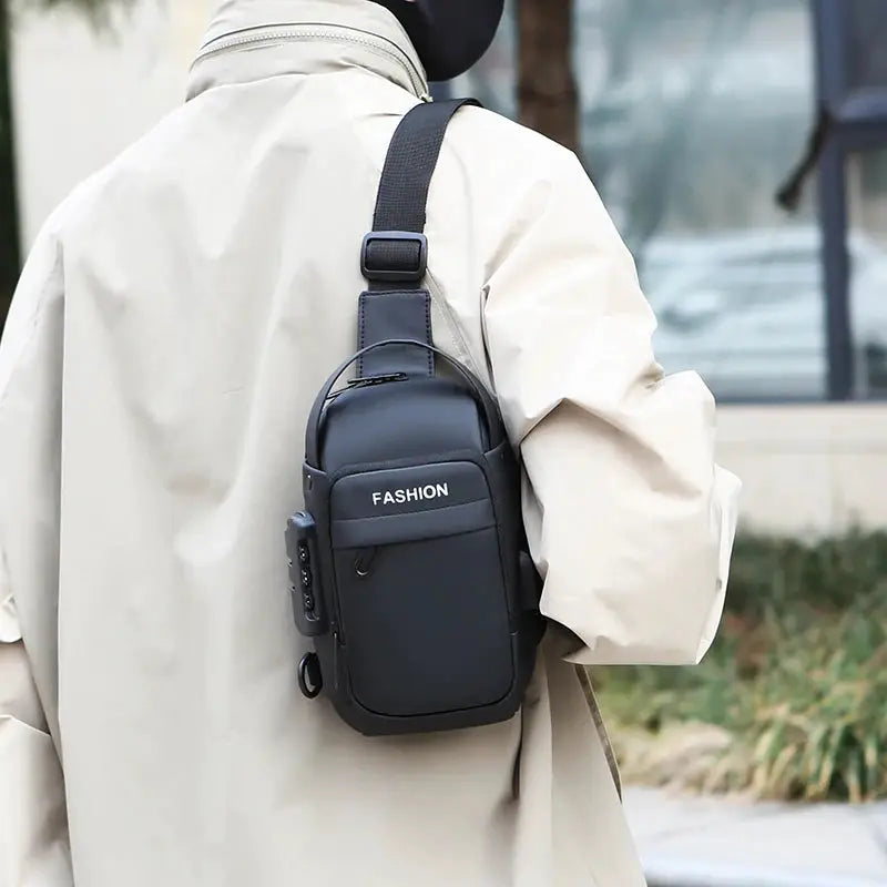 Men's black anti-theft chest bag with crossbody strap, front pocket, fashion label
