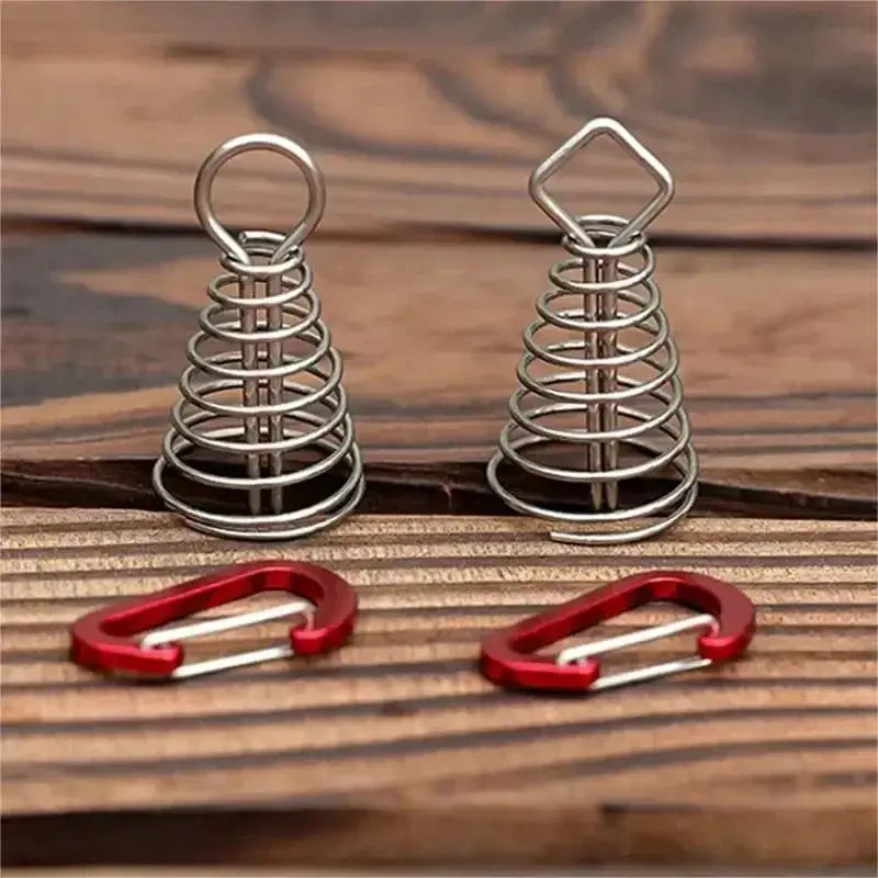 Stainless steel octopus rope buckles pair with red carabiners for camping on wood surface