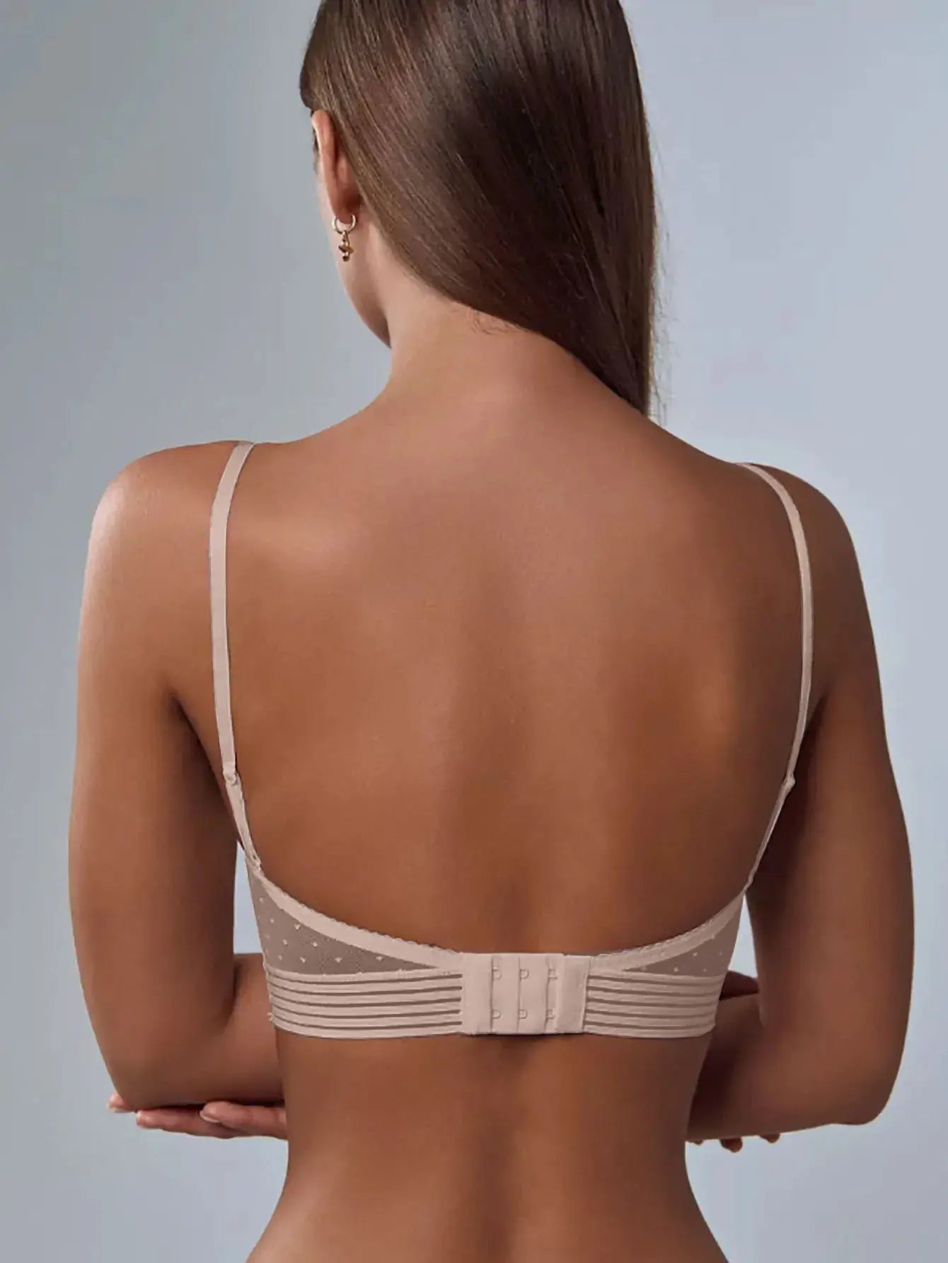 Back bra by Simples Market in beige with adjustable straps and multi-hook closure, rear view.