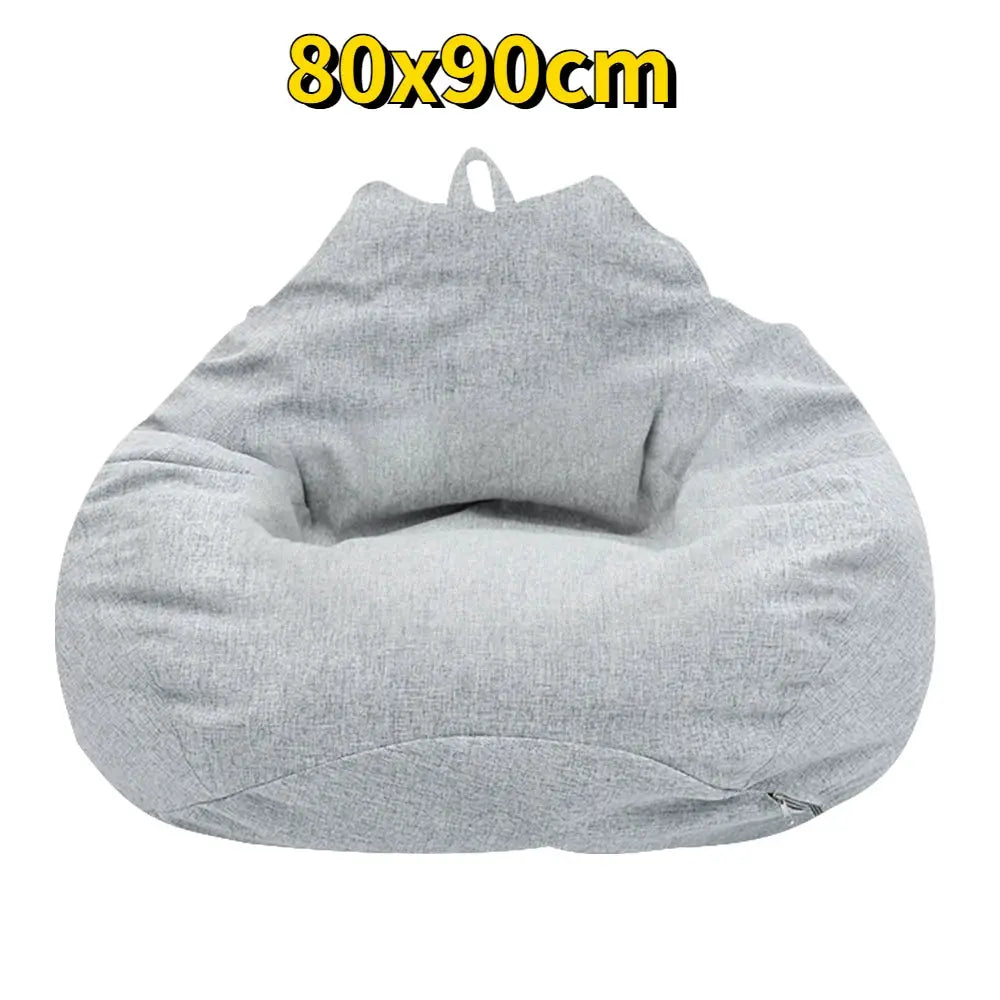 Bean bag chair in gray fabric with zipper closure for adult lounging.
