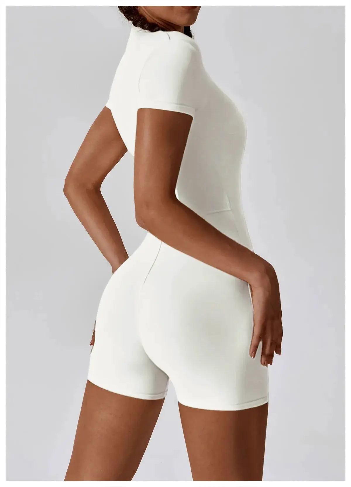 Women's white zip-front short-sleeve yoga jumpsuit by Simples Market; quick-dry, breathable, form-fitting fitness romper