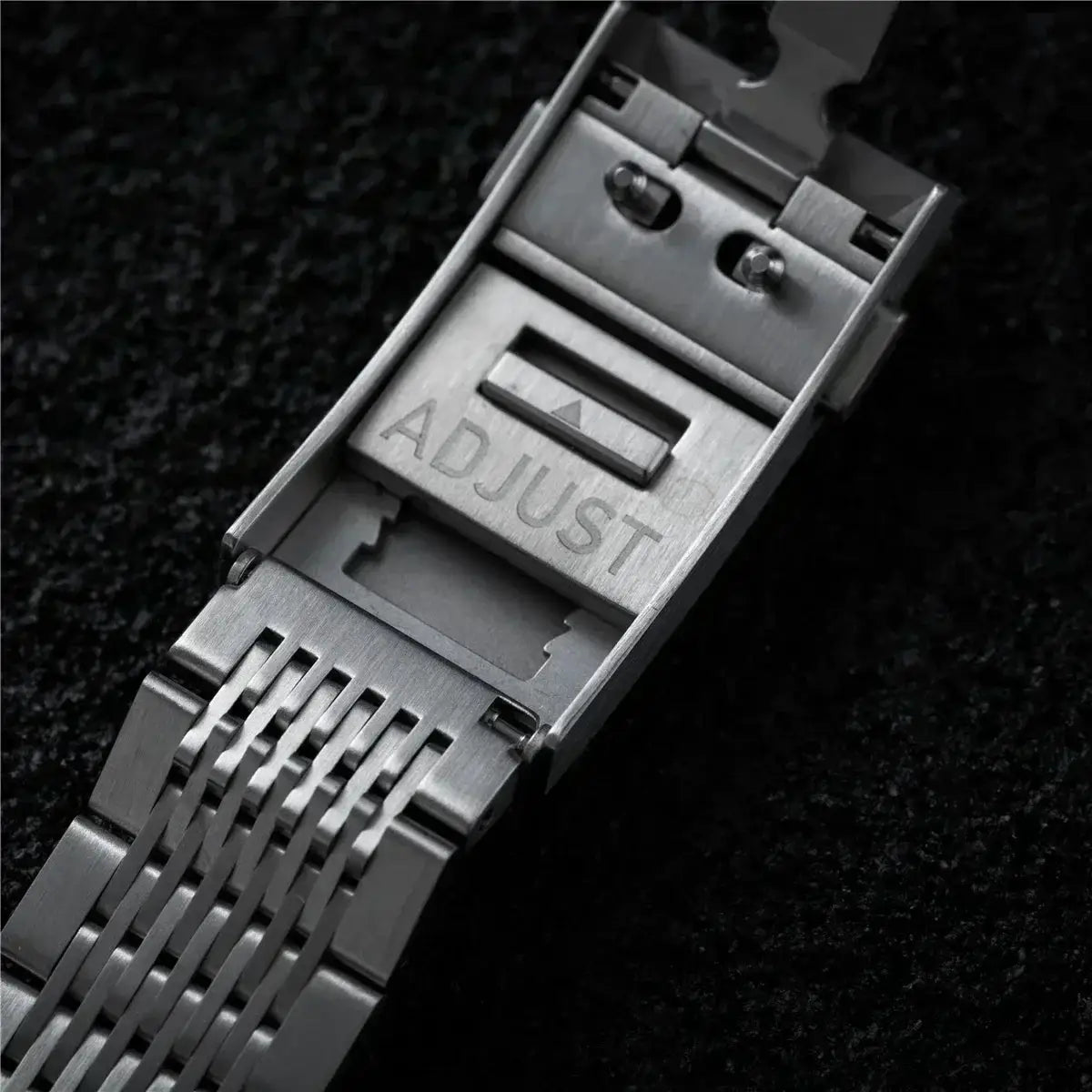 Stainless steel watch band clasp with ADJUST engraving, silver metal finish