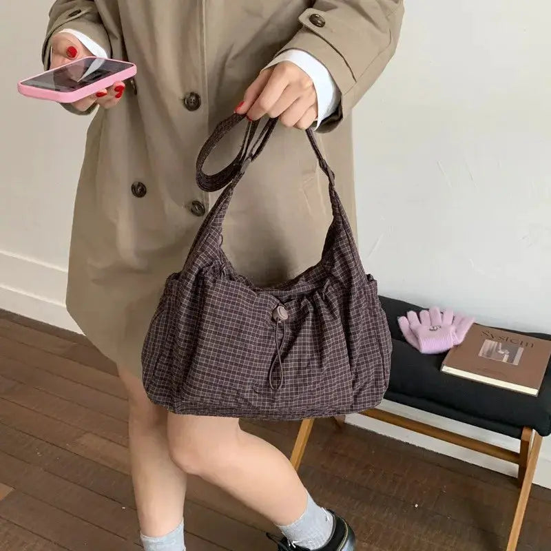 Nylon plaid shoulder bag by Simples Market with drawstring closure in brown plaid