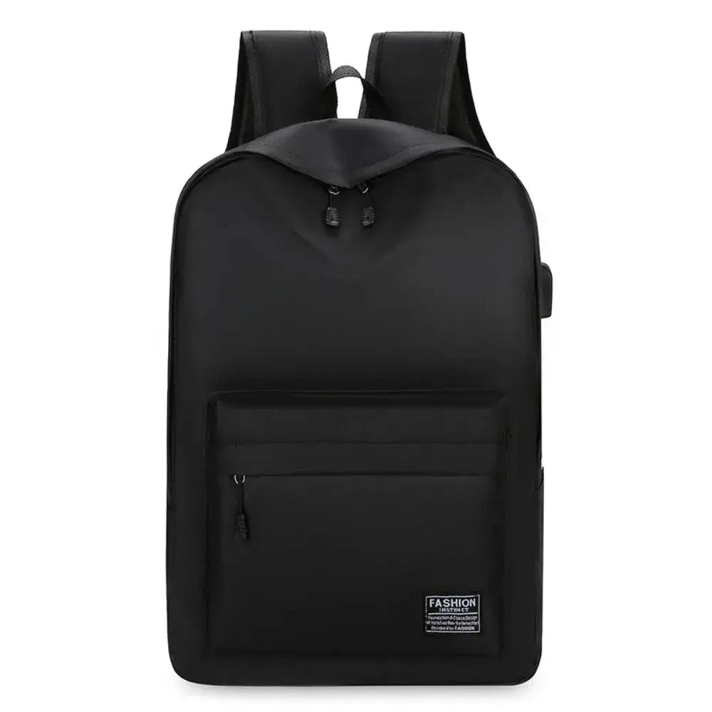 Black minimalist backpack with front zip pocket and top handle