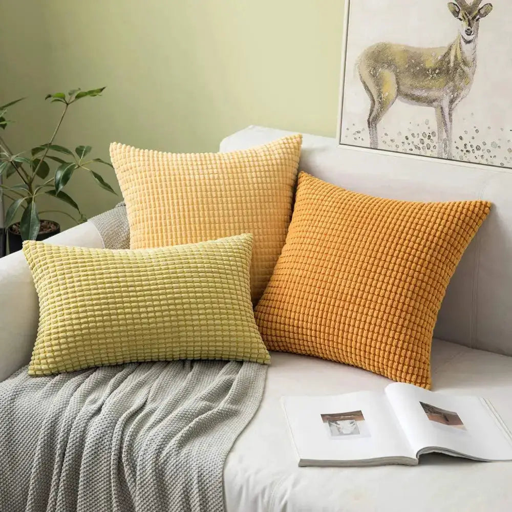 Corduroy corn-kernel plush cushion covers, set of 3 by Simples Market in yellow and orange on sofa