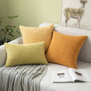 Corduroy corn-kernel plush cushion covers, set of 3 by Simples Market in yellow and orange on sofa