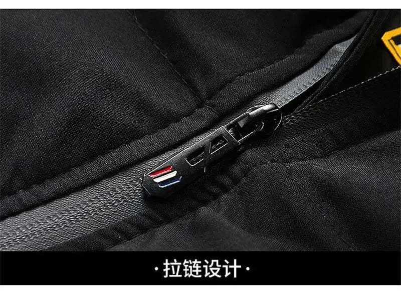 Men's black down jacket zipper close-up, waterproof puffer with tri-color zipper pull.