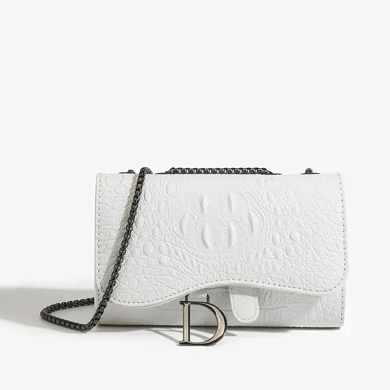 White crocodile-textured crossbody handbag with black metal chain and D logo.
