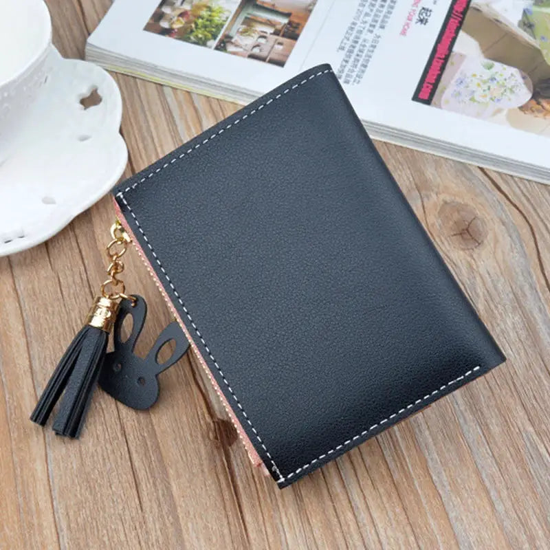Fashion wallet by Simples Market, black PU leather with white stitching, pink zipper edge and tassel