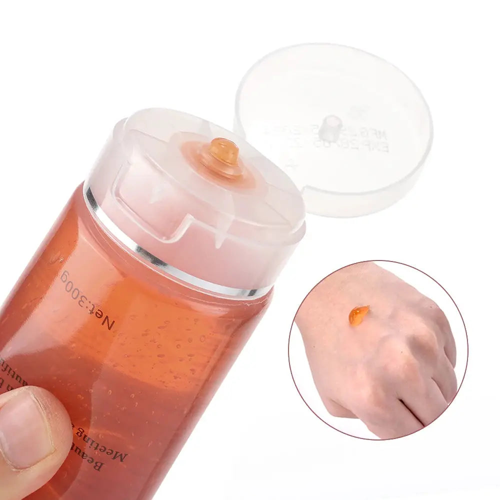 Body slimming massager orange gel bottle with flip-top cap; inset shows gel drop on hand