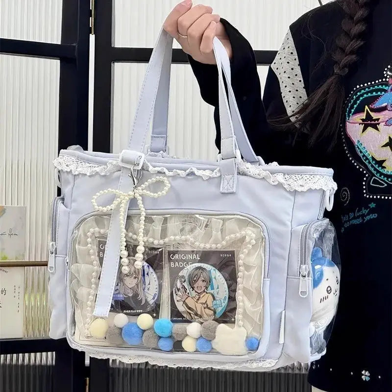 Itabag crossbody bag Ballet Girl Large Appetite in lavender with lace trim and clear front pocket showing badges