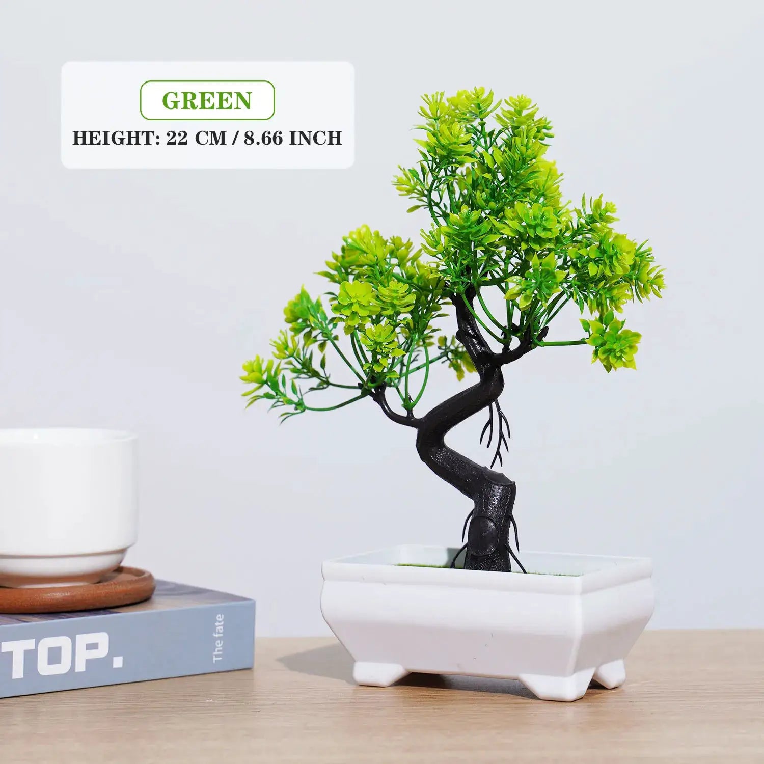 Artificial bonsai small tree in a white ceramic pot with vibrant green foliage for tabletop decor.