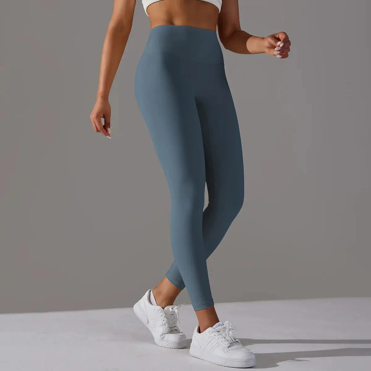 High-waist naked-feeling women's leggings in teal blue, ideal for fitness, yoga, and running.