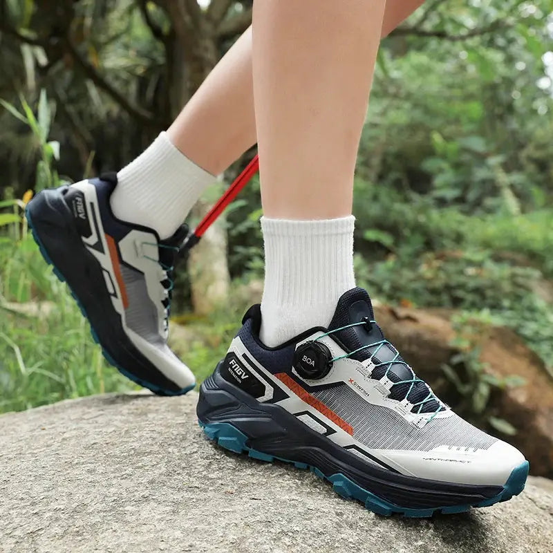 Men's breathable running shoes by Simples Market; white and navy upper with orange accents and teal outsole.