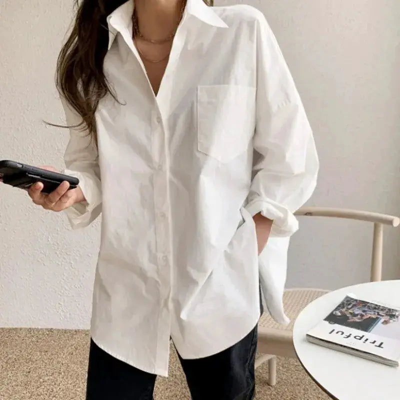 White cotton oversized blouse with rolled sleeves, turn-down collar and chest pocket