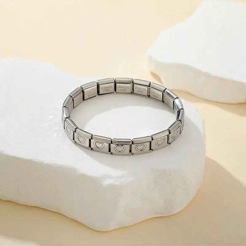 Unisex stainless steel elastic bracelet with heart-link blocks, 9mm wide