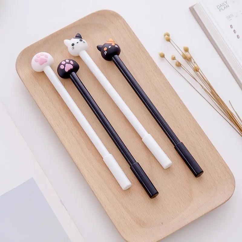 Kawaii cat gel signature pens by Simples Market; 4 pens with claw toppers, white and black bodies, black ink