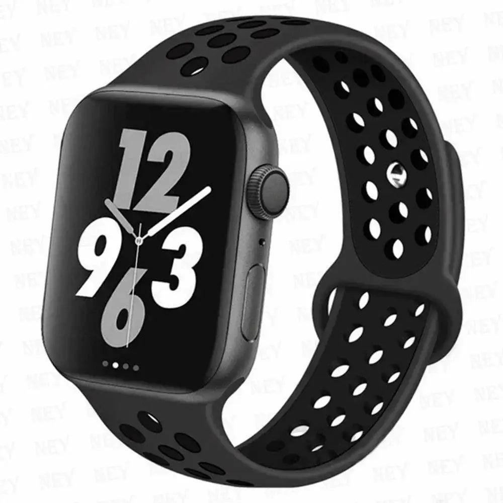 Silicone sport strap for Apple Watch, black perforated band with breathable holes; fits 38-49mm models.