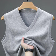 Men's grey knit sleeveless V-neck sweater vest on a wooden hanger
