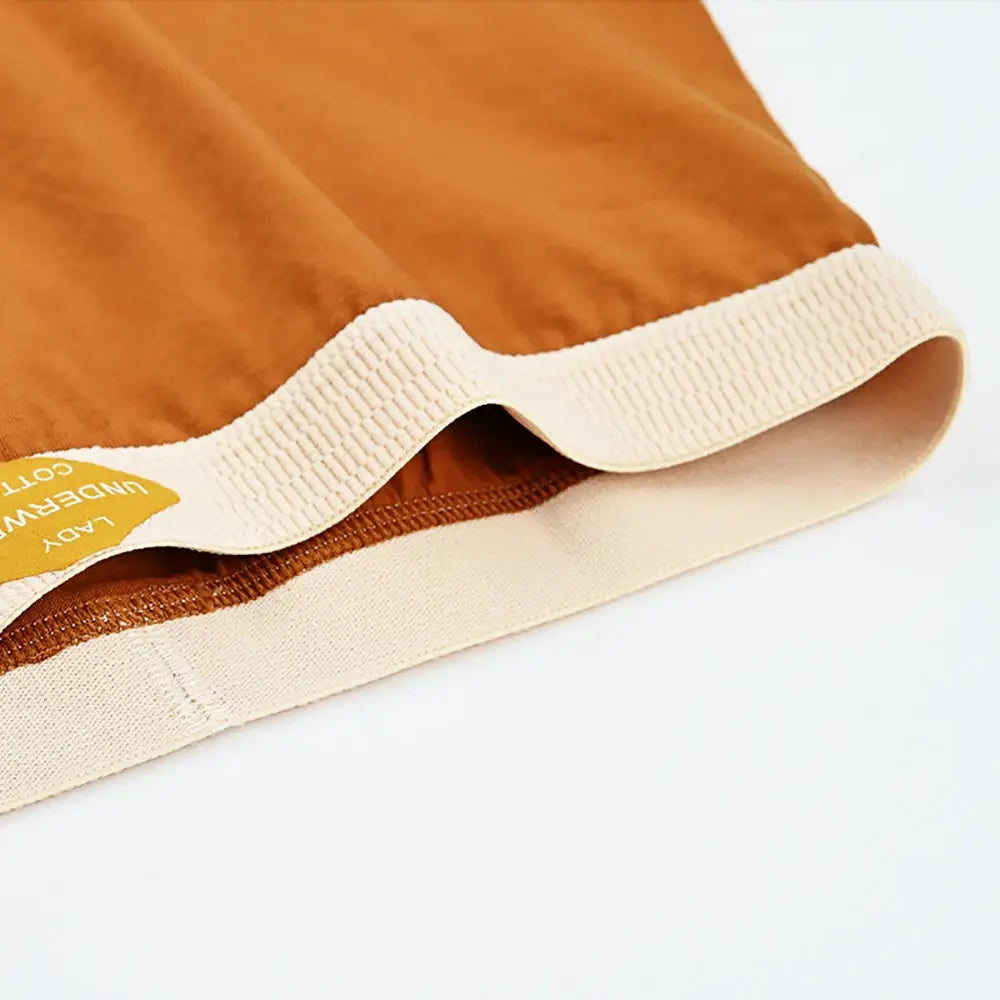 Women's mid-rise boxer shorts in orange-brown cotton knit with cream elastic waistband