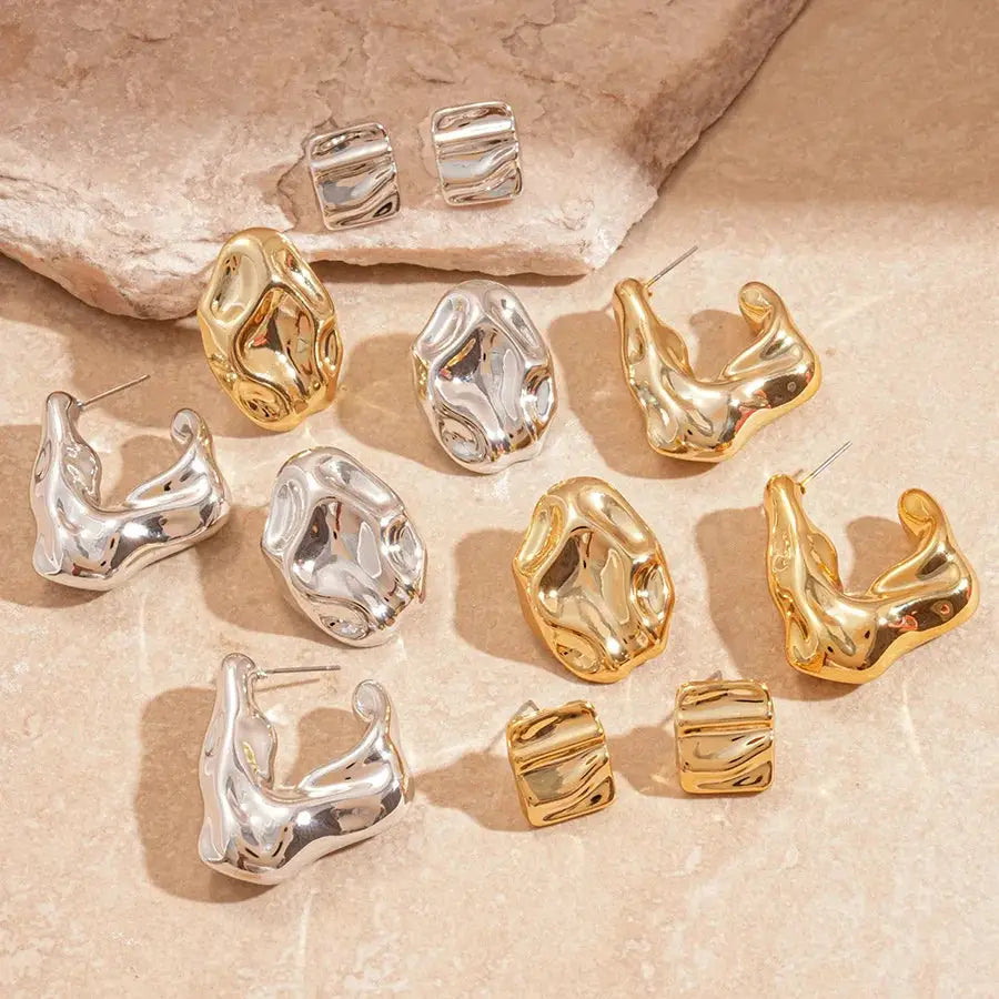 Gold and silver irregular pleated oval acrylic stud earrings set with geometric designs, unisex party jewelry