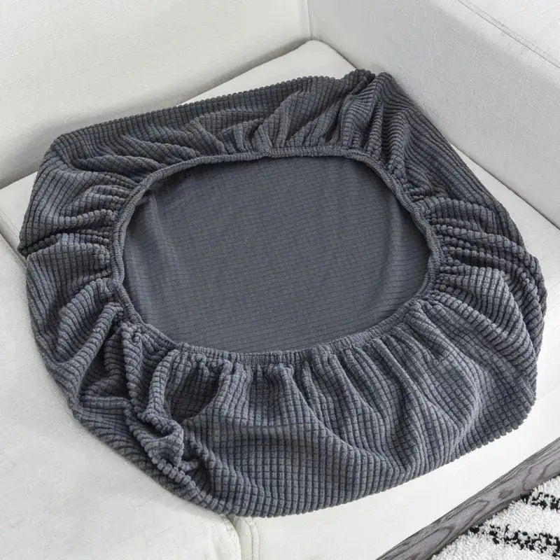 Round polar fleece sofa cushion cover with elastic edge in dark gray.